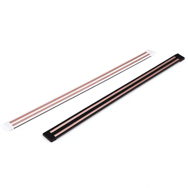 A detailed cross-section of co-extruded conductive profiles showing copper inserts within a plastic housing.